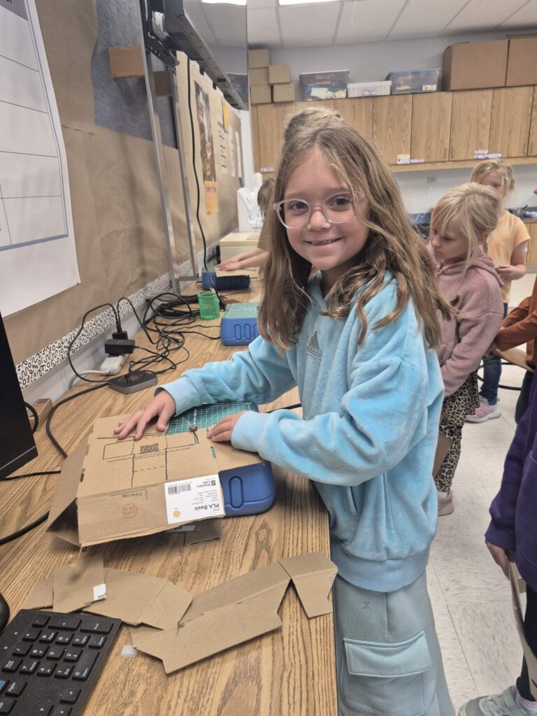 Girl using cardboard cutter