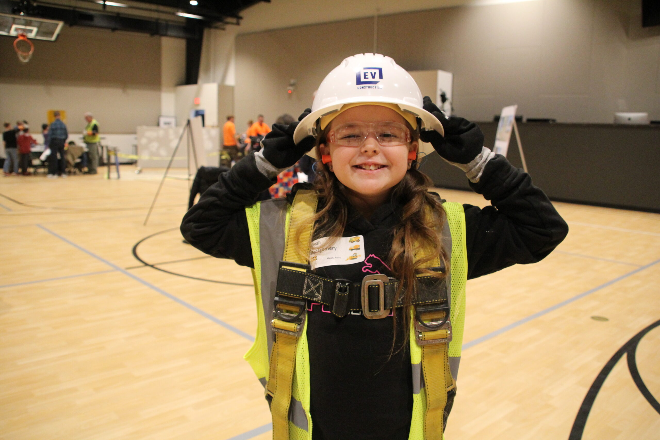 Young girl in hard hat for career day