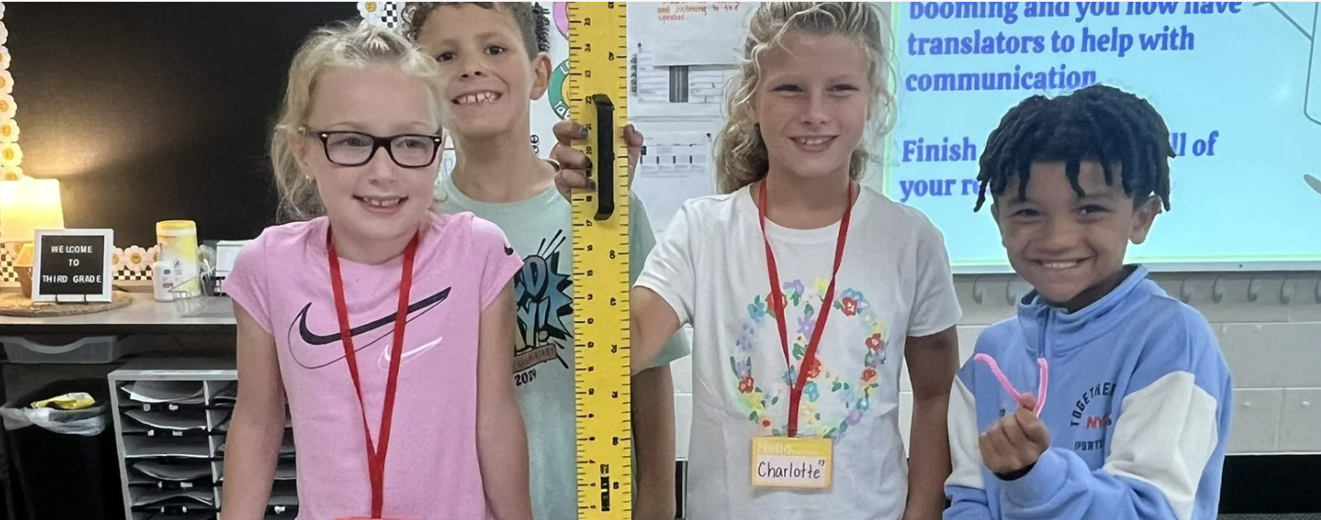 Students with a giant ruler